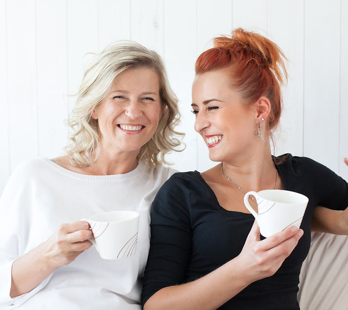 Women Laughing on Couch