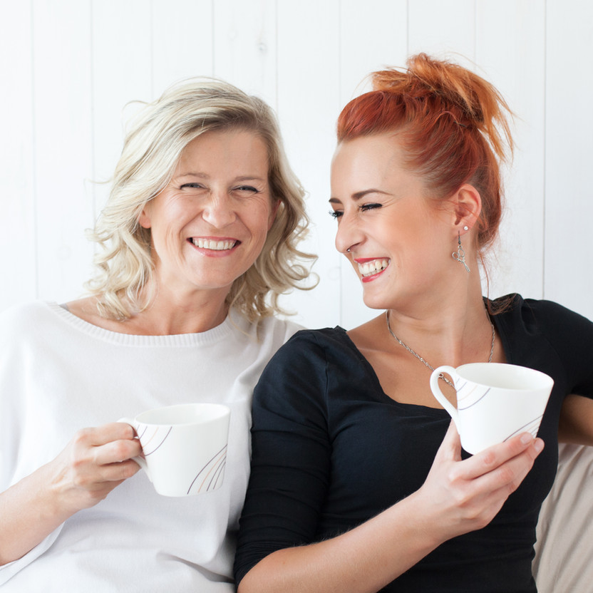 Women Laughing on Couch