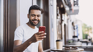Smiling Man with a Smartphone