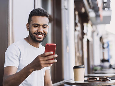 Smiling Man with a Smartphone