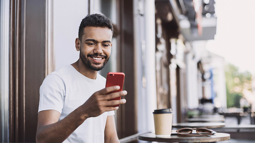 Smiling Man with a Smartphone