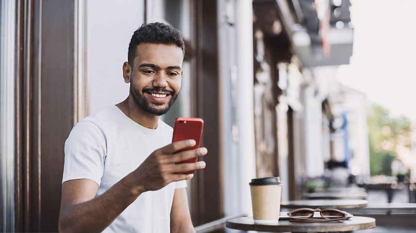 Smiling Man with a Smartphone