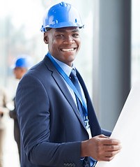 Engineer Holding Plans