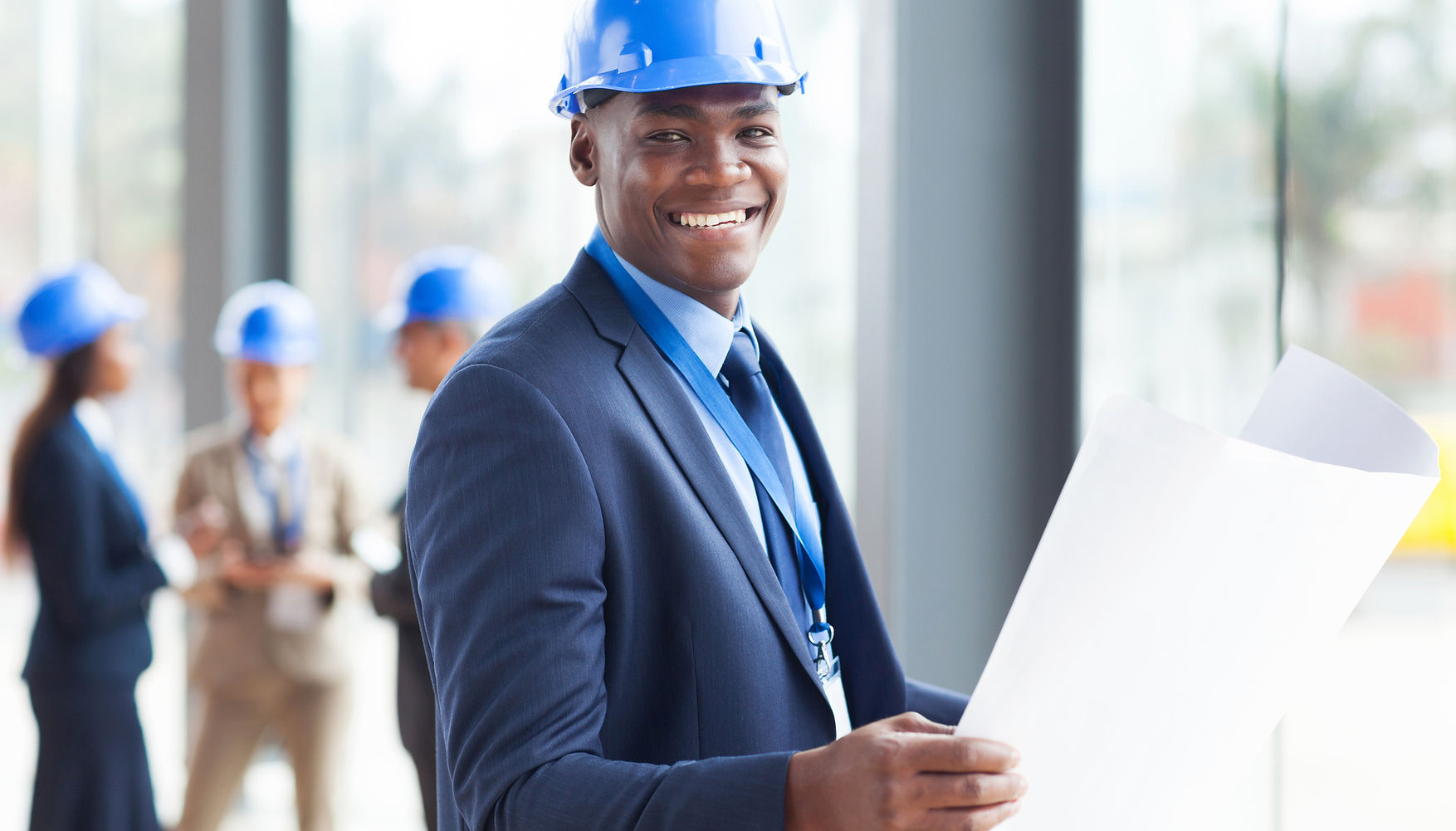 Engineer Holding Plans