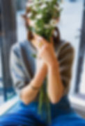 Person Holding Flowers