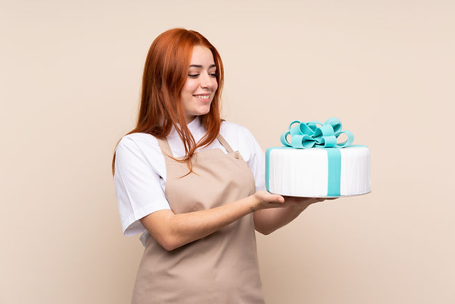 Baker Holding Cake