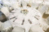 Elegant banquet table set with white linen