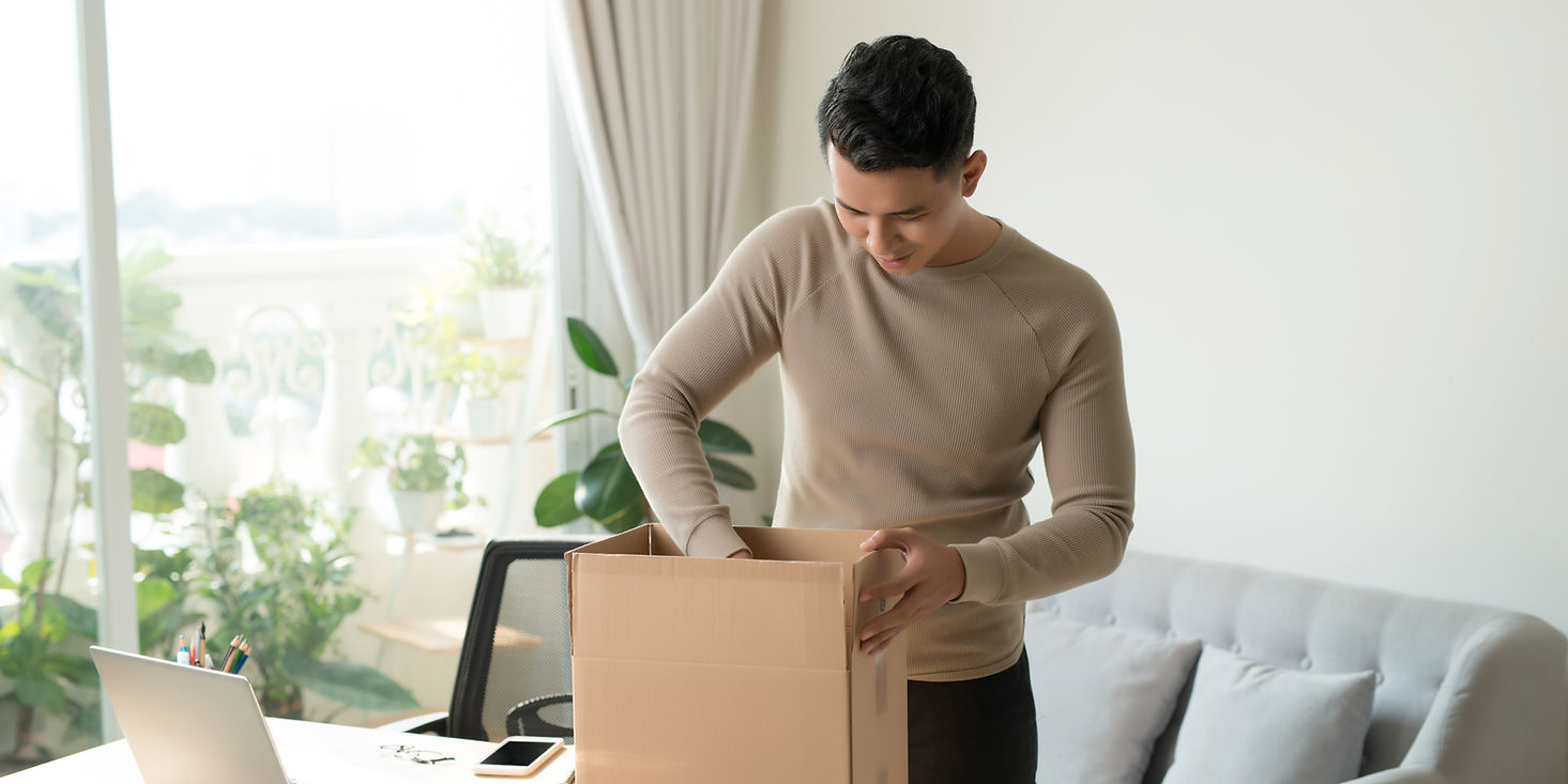 Man opening cardboard parcel