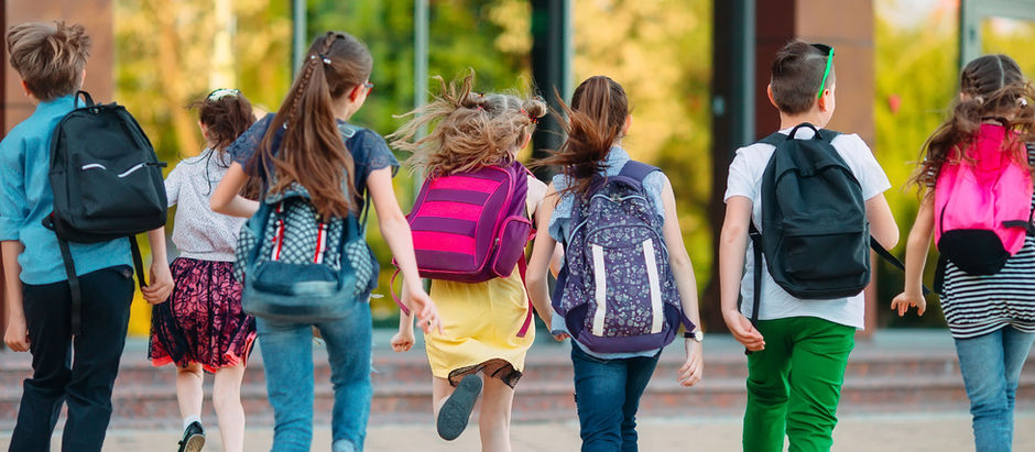 Children running back to school