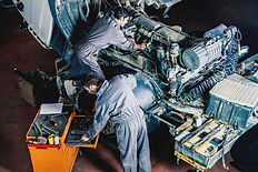 Auto and trucks mechanics working on a truck