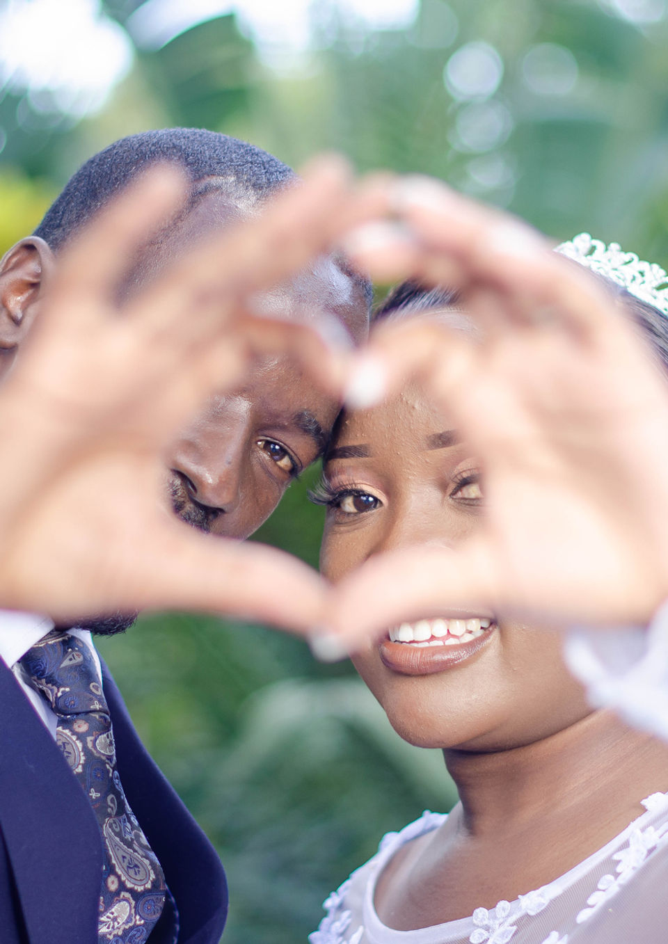 Wedding Photography by Blake Ferguson showcases a Happy Couple interjoining a Heart with their hands in Ontario, Canada.