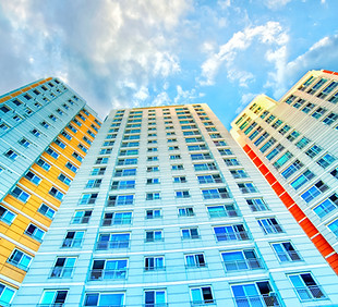 Colorful High-rise Building Against Blue Sky