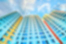 Colorful High-rise Building Against Blue Sky