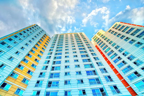 Colorful High-rise Building Against Blue Sky