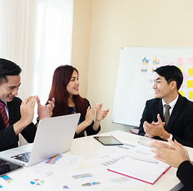 Cheerful Asian company's business meeting