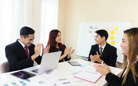 Cheerful Asian company's business meeting