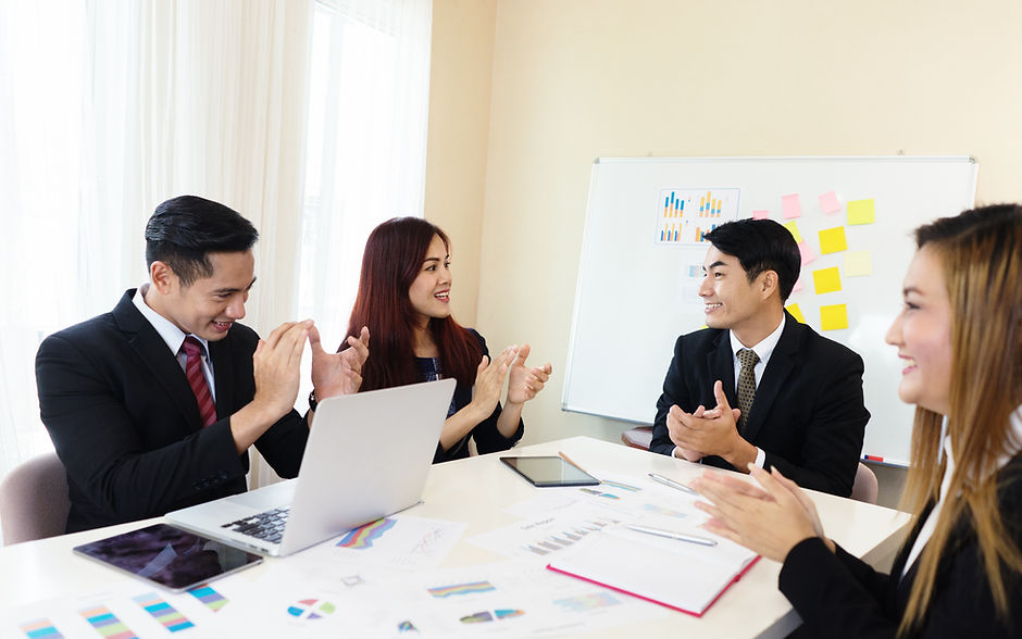 Cheerful Asian company's business meeting