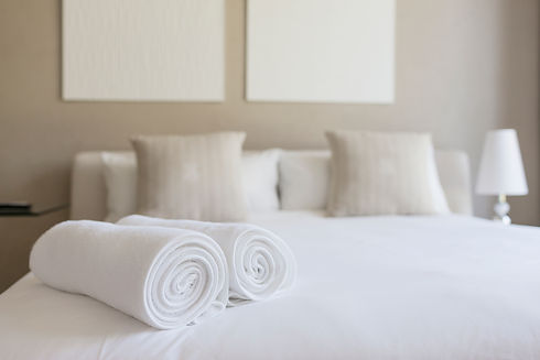 Towels on a bed in a bedroom