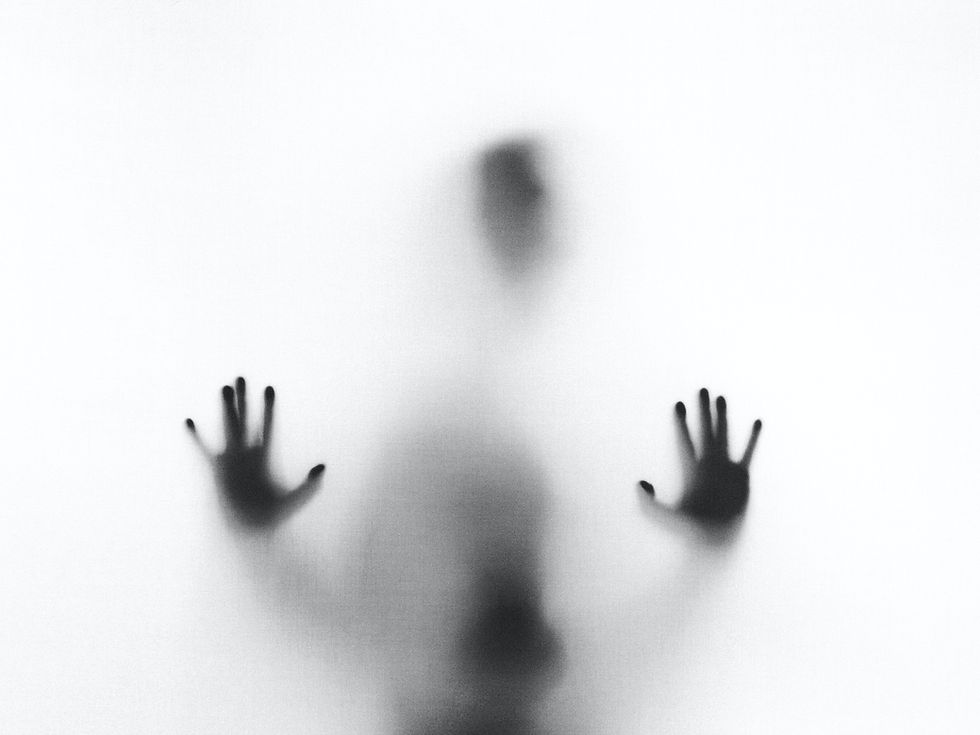 Silhouette Behind Glass