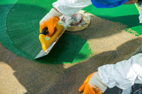 Close-up of artificial grass installation by JLF Fraire Construction.
