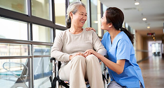 Caregiver Assisting Woman