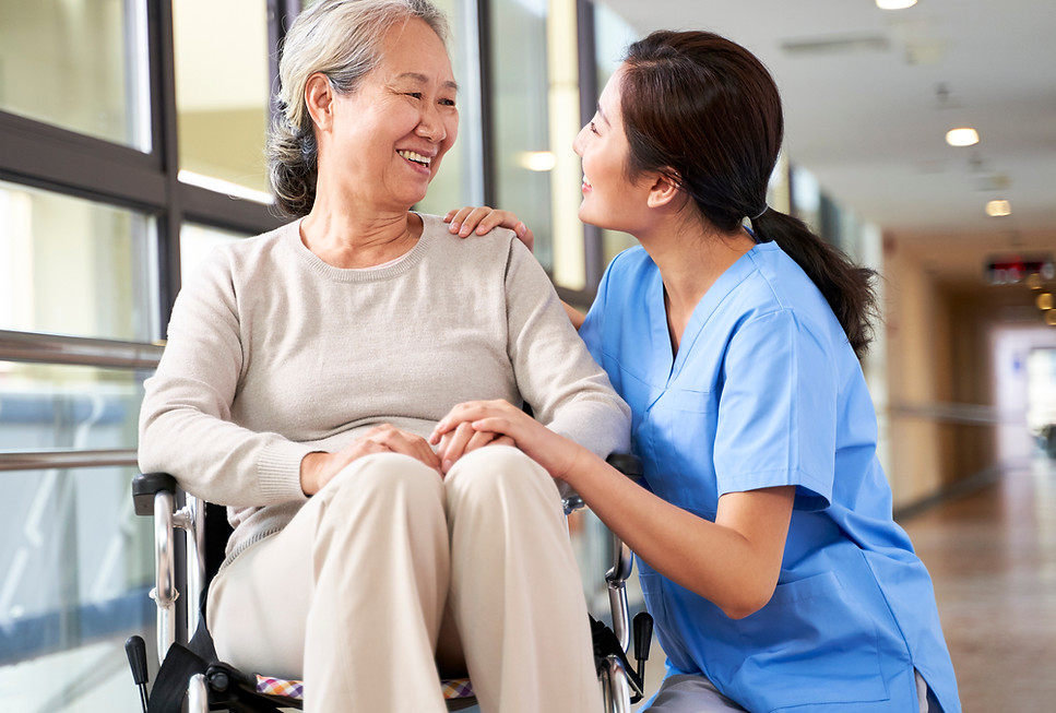 Caregiver Assisting Woman