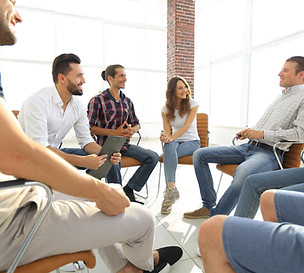 A group of people sitting and talking