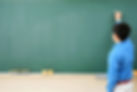 Teacher and Blackboard