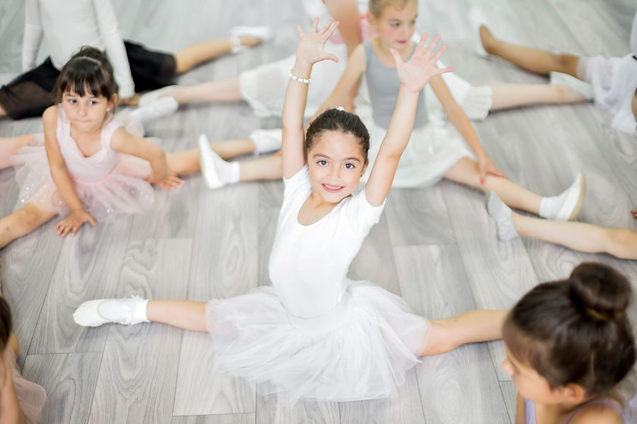 Little girls dancing ballet in studio