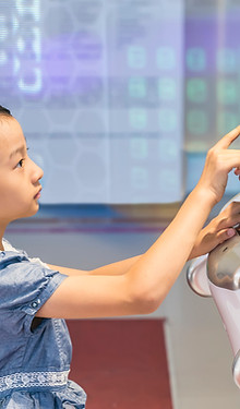 Girl Interacts With Robot