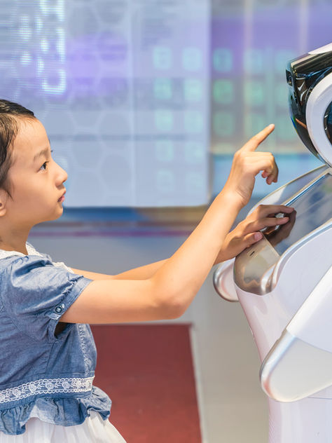 Child and robot interacting