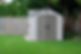 A small shed in a residential backyard