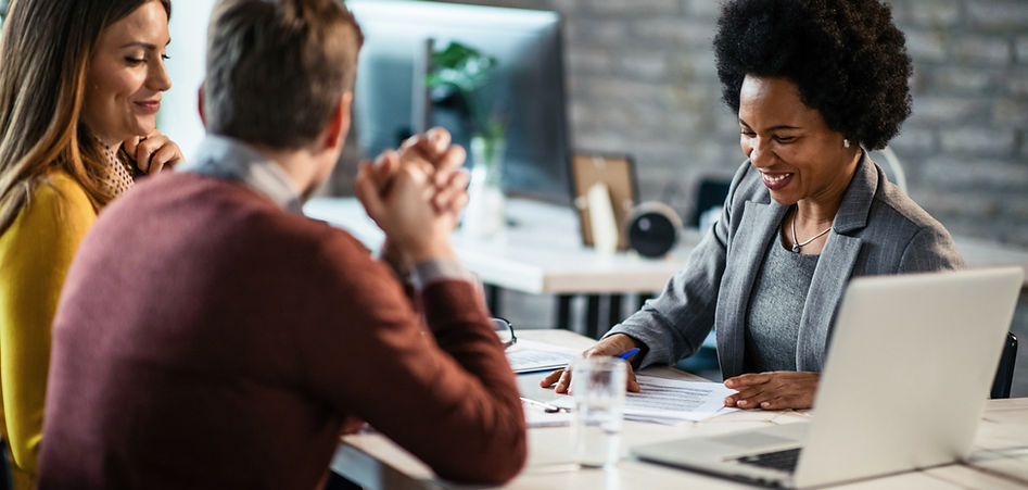 Professional accountants discussing financial documents at SanyaGold CPA
