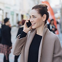 Person smiling on a phone call