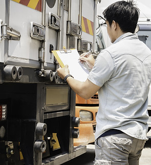 Truck Driver Writing on Document