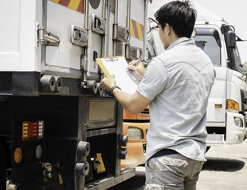 Truck Driver Writing on Document