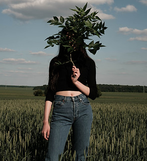 Woman Hiding Behind Leaves