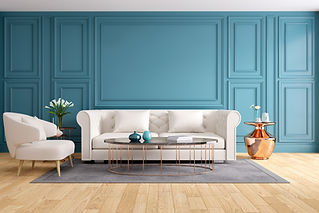 blue wall and white sofa in a room