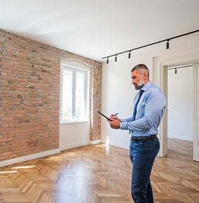 male letting agent inspecting a property