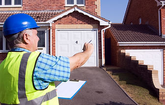 surveyor makes notes on a property