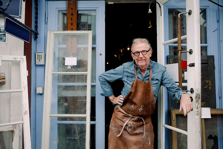 Man Standing Outside Shop