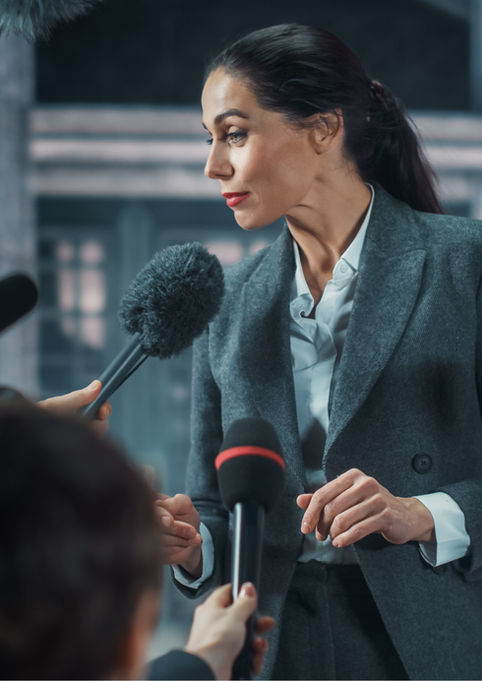 Corporate Event Photography by Blake Ferguson depicts a woman answering Questions proposed by the Press in Ontario, Canada.
