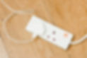 A white plastic extension power cord