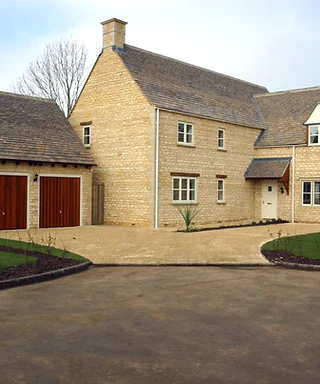 modern driveway with sand coloured block paving