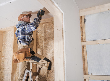 Worker Installing Drywall