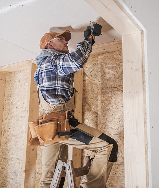 Worker Installing Drywall