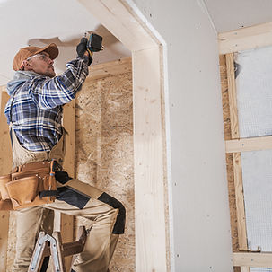 Worker Installing Drywall