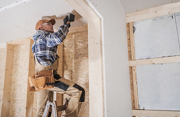 Worker Installing Drywall