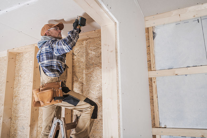Worker Installing Drywall