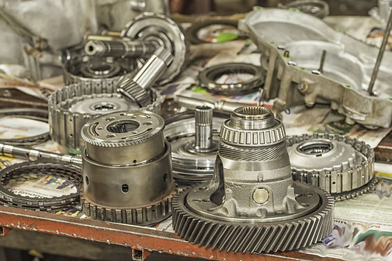Used automatic transmission parts on a workbench